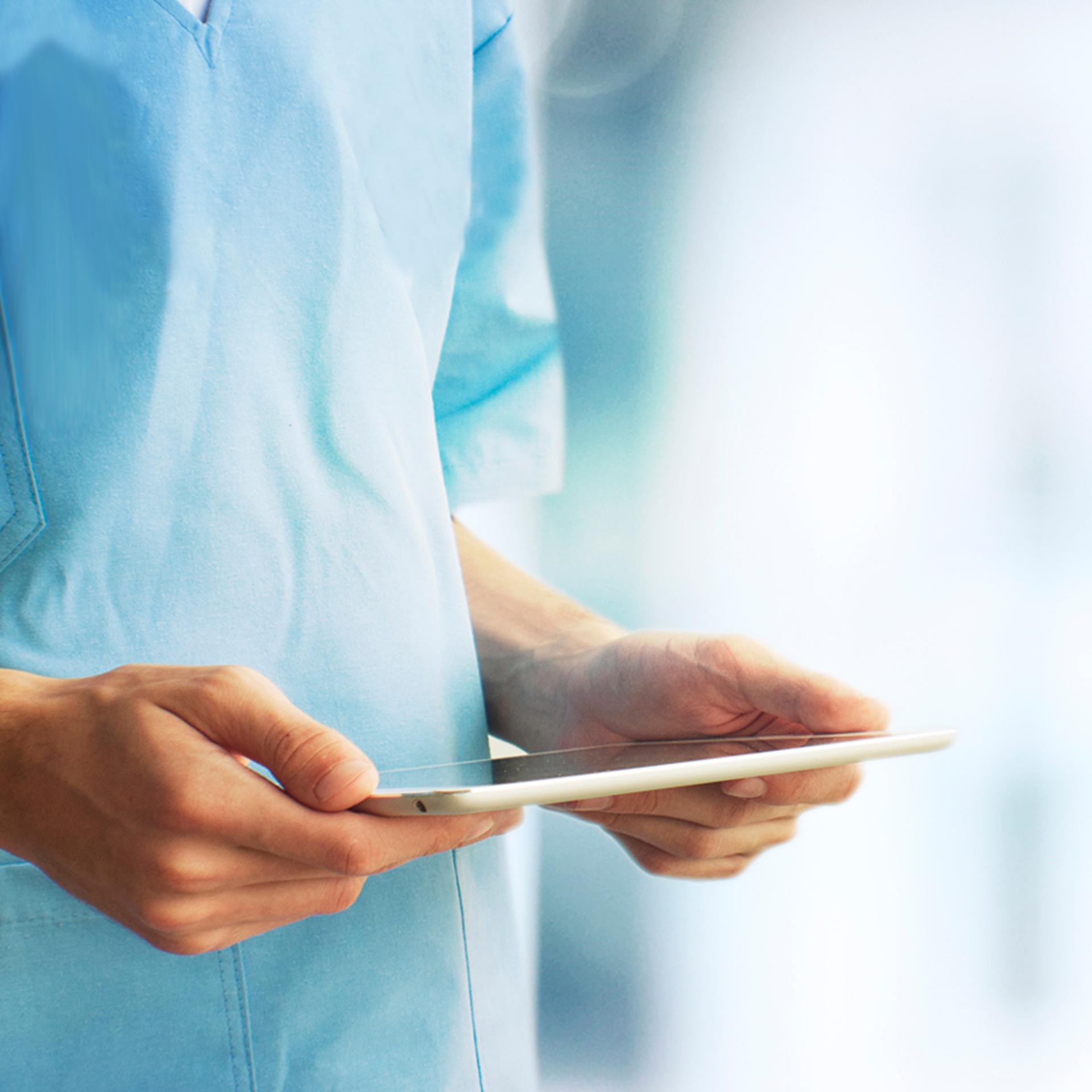 Hospital person holding tablet